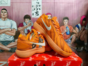 Nike Orange Basketball Sneakers with Animal Graphics
