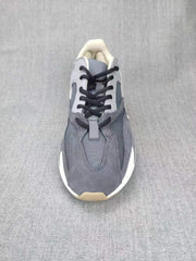 700 Grey Lifestyle Sneakers with Orange Accents