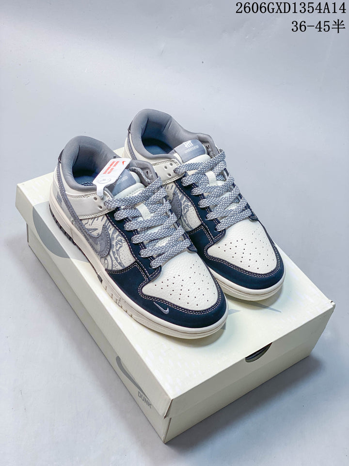 Nike Dunk Low x Undefeated Sneakers in White and Navy
