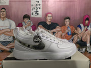 Nike White Low-Top Sneakers with Patterned Swoosh
